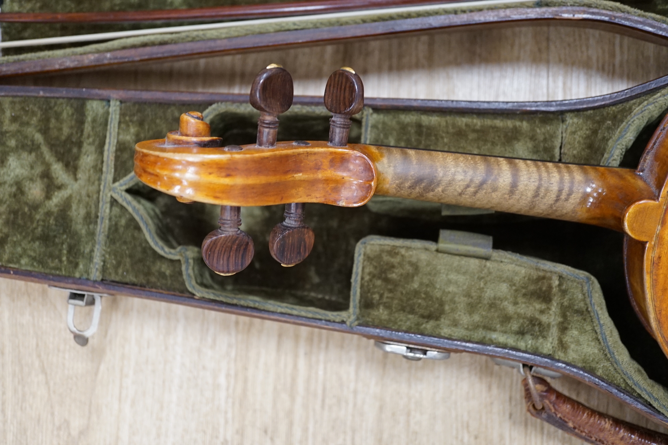 An early 19th century cased Italian violin labelled Florentus Florenus, body length 35cm, with a French silver mounted bow stamped Cuniot Hury, both in a fine Hill style case CITES Submission reference 6VGB2X83